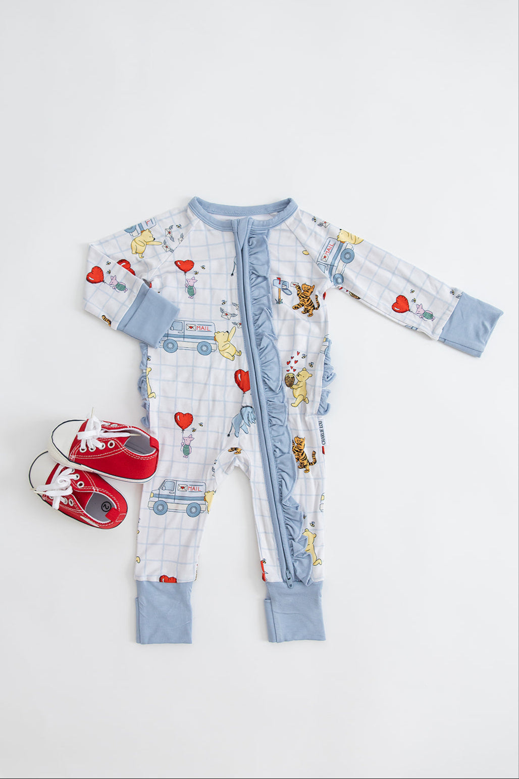 Vintage Winnie the Pooh bamboo pajama Ruffle Convertible Romper with Tigger, Eeyore and Piglet in a Valentine's Day print for baby and toddler boys and girls. Perfect for sibling matching and gender neutral.