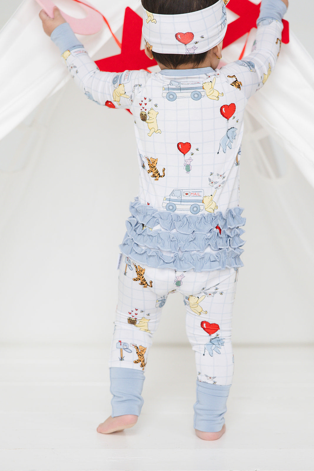 Vintage Winnie the Pooh bamboo pajama Ruffle Convertible Romper with Tigger, Eeyore and Piglet in a Valentine's Day print for baby and toddler boys and girls. Perfect for sibling matching and gender neutral.