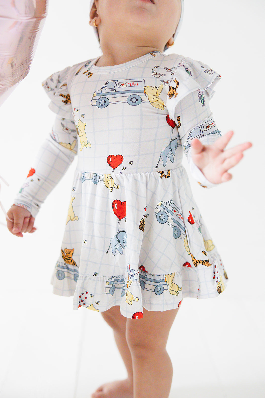 Vintage Winnie the Pooh bamboo twirl dress with Tigger, Eeyore and Piglet in a Valentine's Day print for baby and toddler boys and girls.