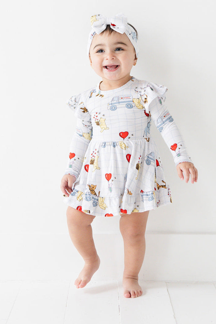 Vintage Winnie the Pooh bamboo twirl dress with Tigger, Eeyore and Piglet in a Valentine's Day print for baby and toddler boys and girls.