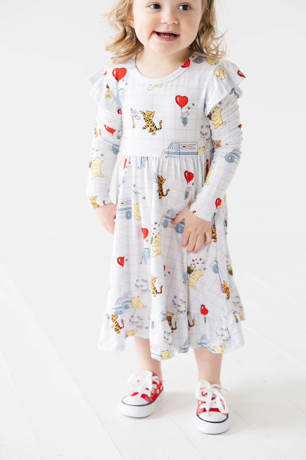 Vintage Winnie the Pooh bamboo twirl dress with Tigger, Eeyore and Piglet in a Valentine's Day print for baby and toddler boys and girls.