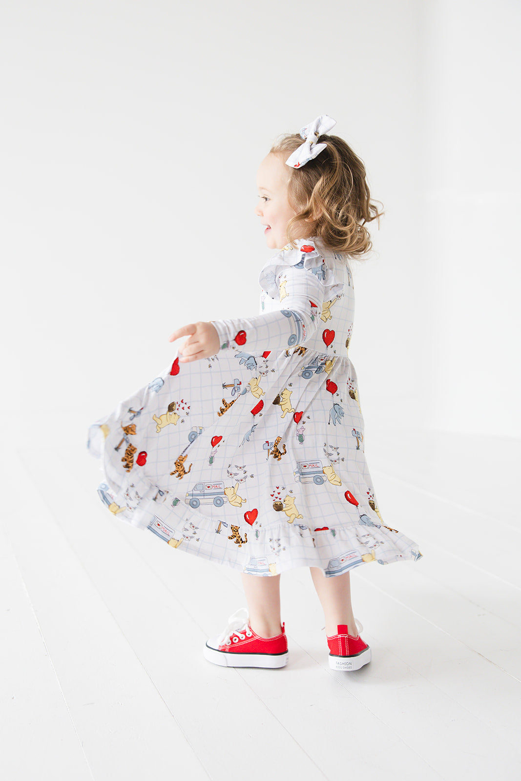 Vintage Winnie the Pooh bamboo twirl dress with Tigger, Eeyore and Piglet in a Valentine's Day print for baby and toddler boys and girls.
