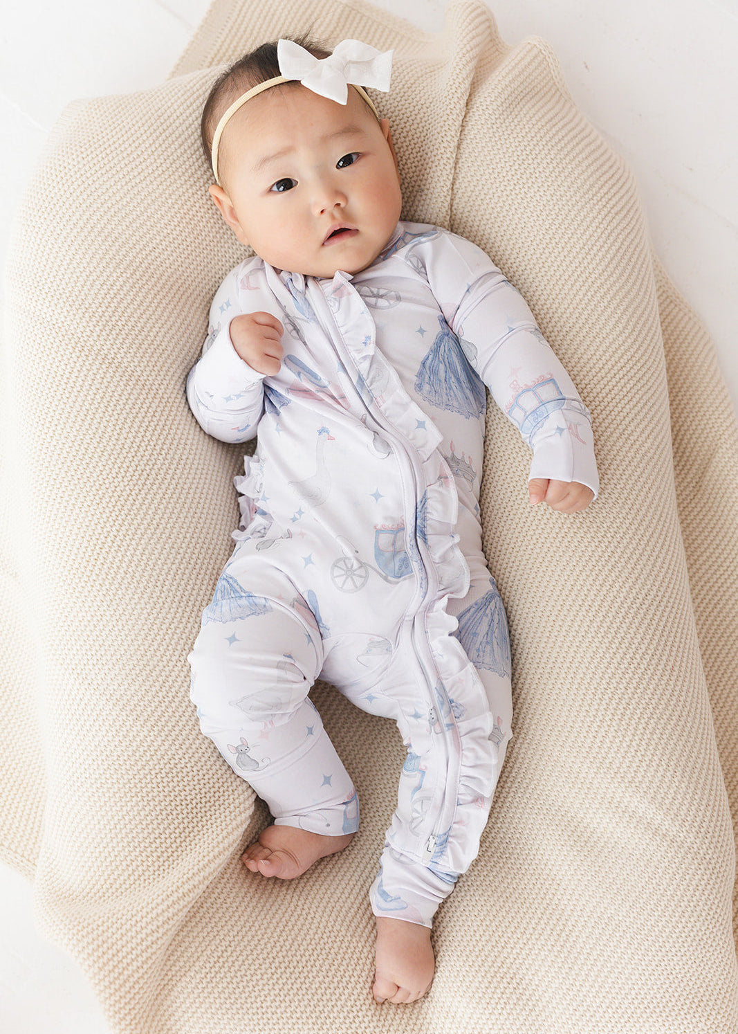 Bamboo convertible double zipper romper with hand and foot cuffs. Zippy has a vintage Disney Cinderella print on it.