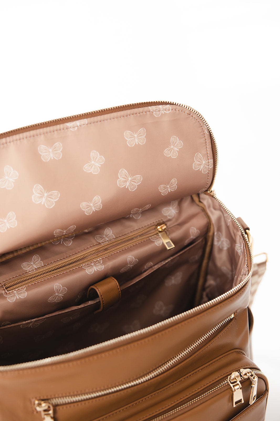 Brown faux leather large diaper bag with checkered cross body strap, insulated bottle pockets, changing mat, and stroller straps.