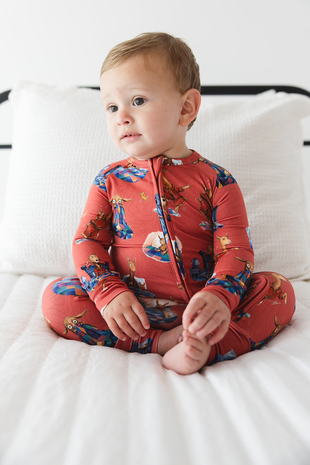 Bamboo convertible romper with hand and foot cuffs for babies and toddlers, both boys and girls. Print features a red background with Llama Llama Red Pajama.
