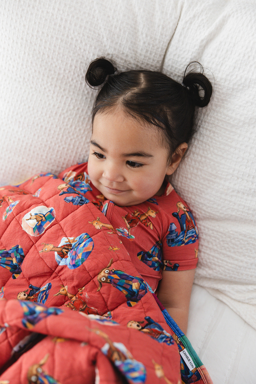 Bamboo double zipper shortie romper for babies and toddlers, both boys and girls. Print features a red background with Llama Llama Red Pajama.