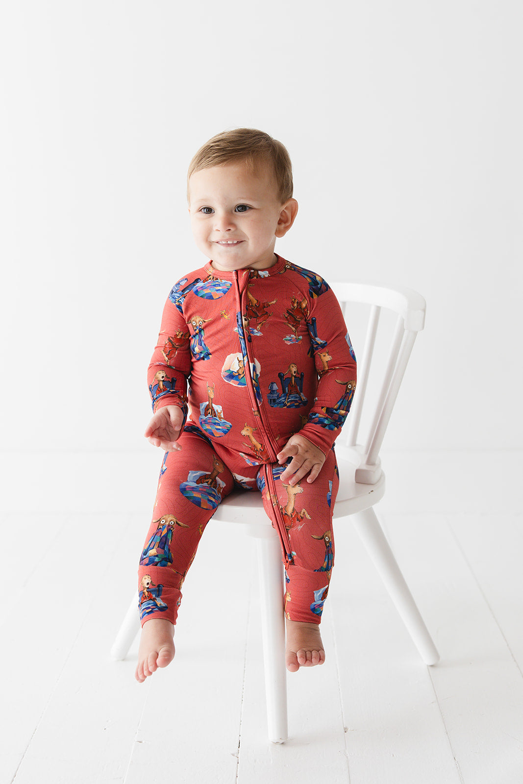 Bamboo convertible romper with hand and foot cuffs for babies and toddlers, both boys and girls. Print features a red background with Llama Llama Red Pajama.