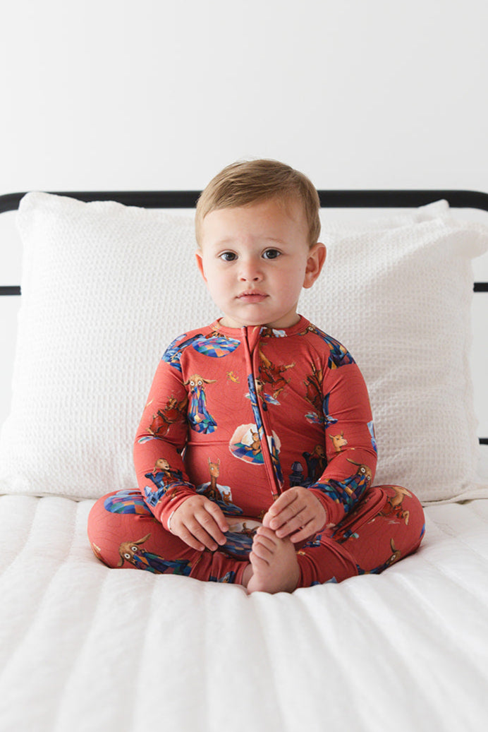 Bamboo convertible romper with hand and foot cuffs for babies and toddlers, both boys and girls. Print features a red background with Llama Llama Red Pajama.
