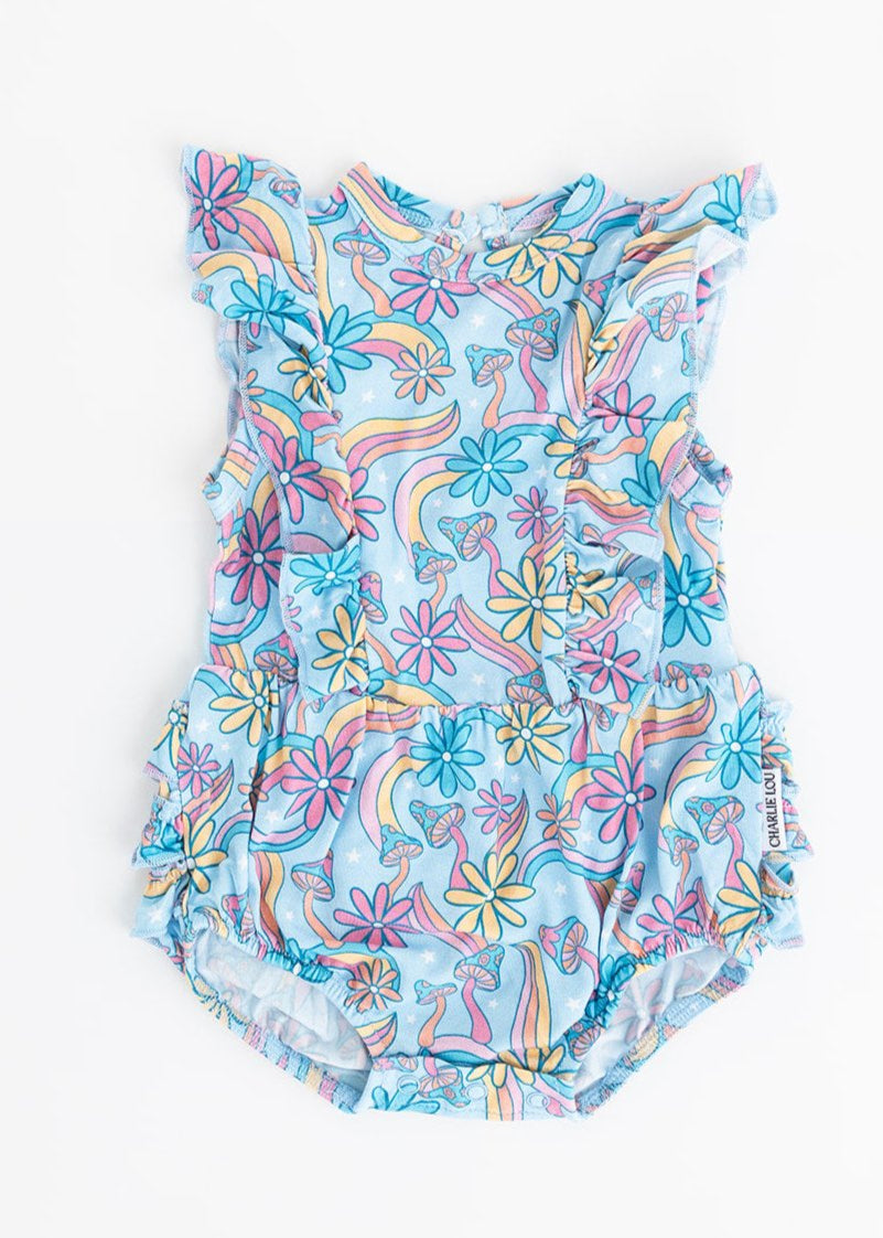 Bamboo bubble ruffle bodysuit with a groovy, hippie, 70’s style print that has florals and mushrooms on it for baby girls. This bamboo fabric has blues, pinks and oranges on it and is hypoallergenic, has UV protection and is temperature regulating.