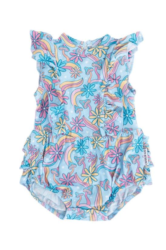 Bamboo bubble ruffle bodysuit with a groovy, hippie, 70’s style print that has florals and mushrooms on it for baby girls. This bamboo fabric has blues, pinks and oranges on it and is hypoallergenic, has UV protection and is temperature regulating.