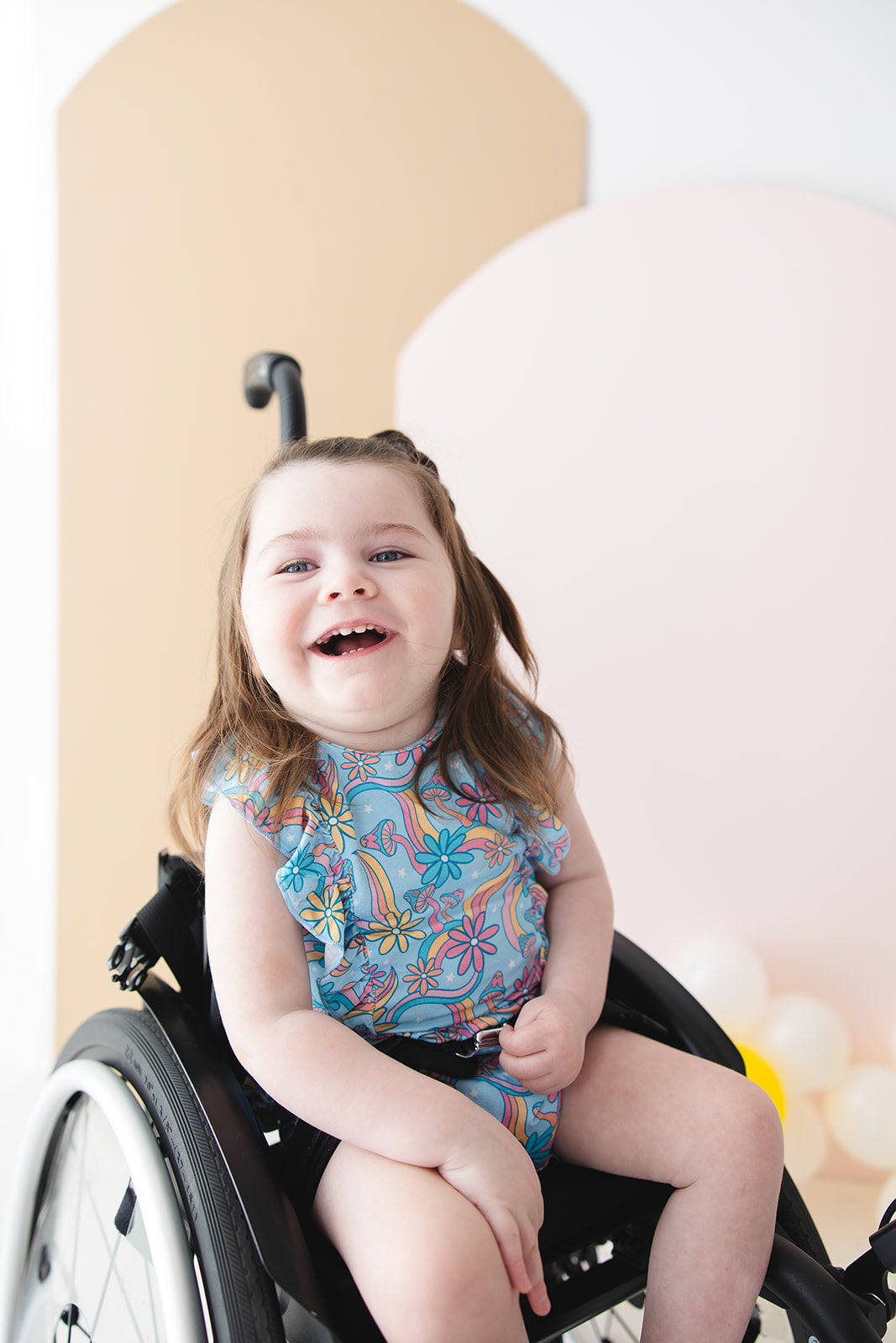 Bamboo bubble ruffle bodysuit with a groovy, hippie, 70’s style print that has florals and mushrooms on it for baby girls. This bamboo fabric has blues, pinks and oranges on it and is hypoallergenic, has UV protection and is temperature regulating.
