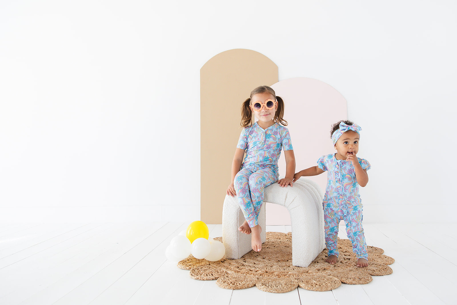 Bamboo pajama set for toddler girls in groovy, hippie, 70’s style print with mushrooms and florals on it. Button down collar and back pocket and the bamboo fabric is hypoallergenic, temperature regulating and is moisture wicking.