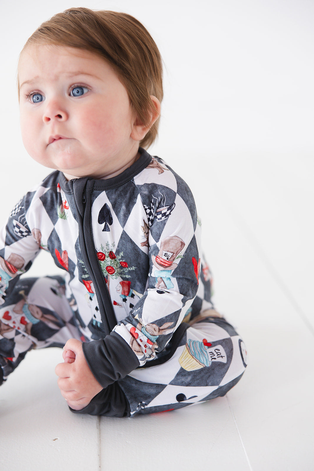 Vintage Alice in Wonderland convertible bamboo romper for baby boys and girls and gender neutral. Bamboo zippy that has UV protection, is hypoallergenic, temperature regulating and moisture wicking.
