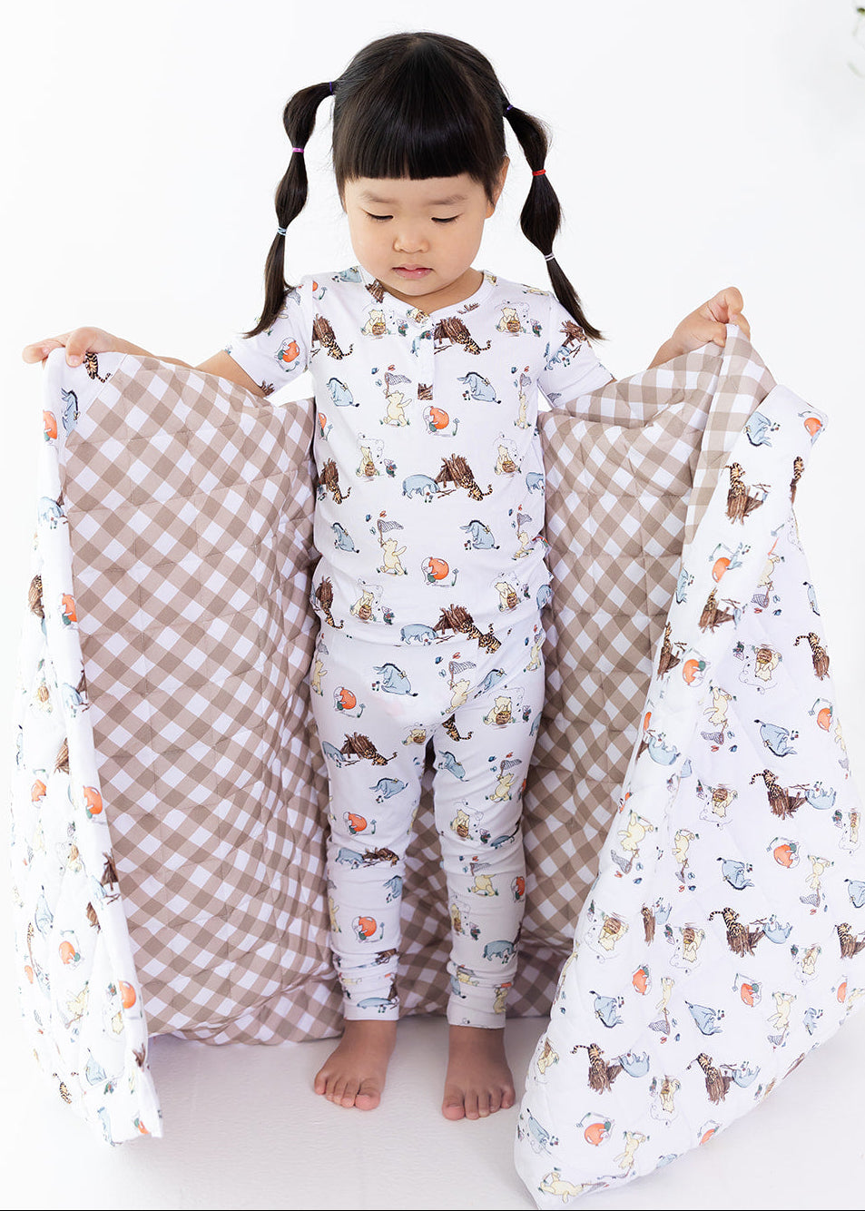 Winnie the Pooh and gingham bamboo quilted blanket.
