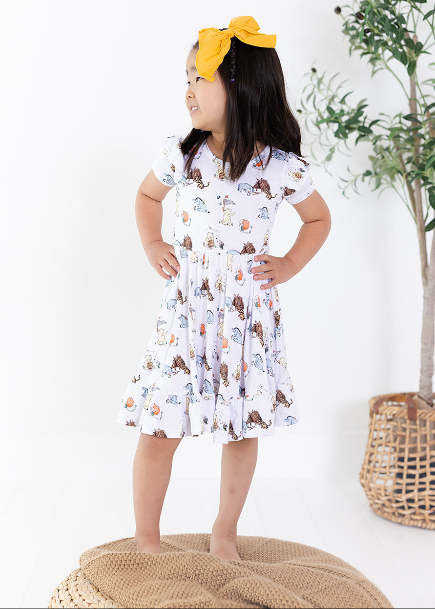 Little girl Winnie the Pooh bamboo twirl dress with matching shorts for Fall.