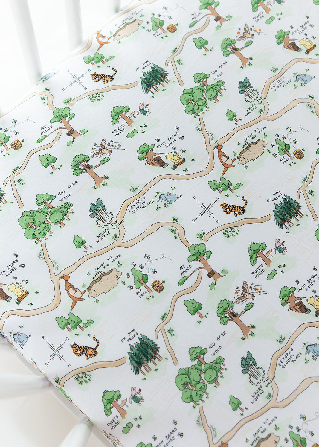 Winnie the Pooh Hundred Acre Wood bamboo crib sheet.