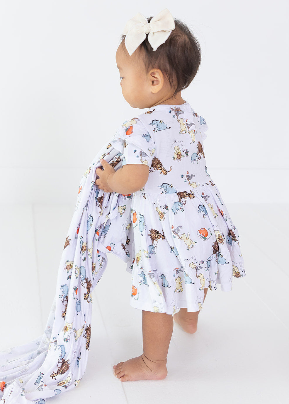 Little girl Winnie the Pooh bamboo twirl dress with matching shorts for Fall.