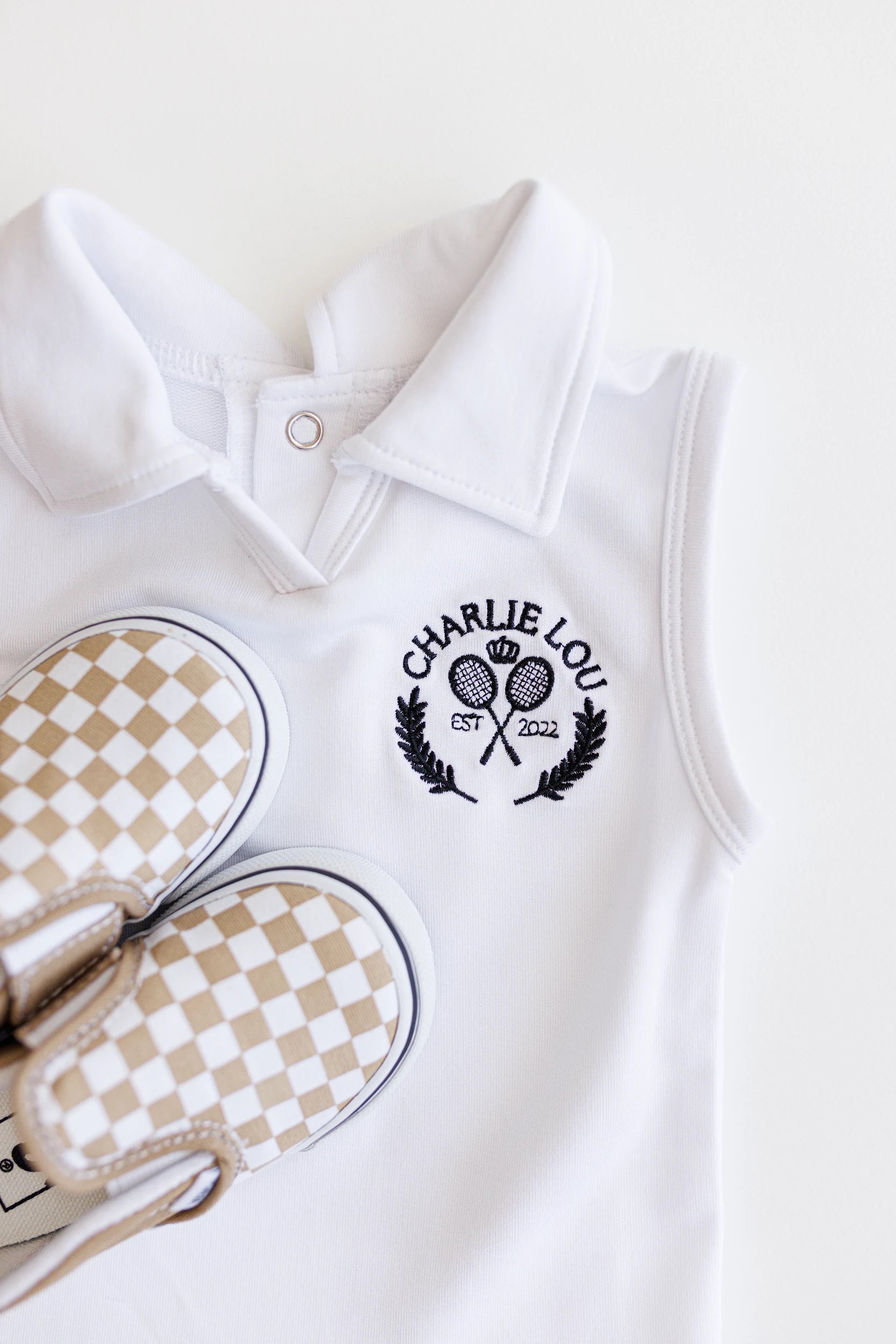Baby girls and toddler girls white tennis dress made from bamboo with bodysuit underneath.