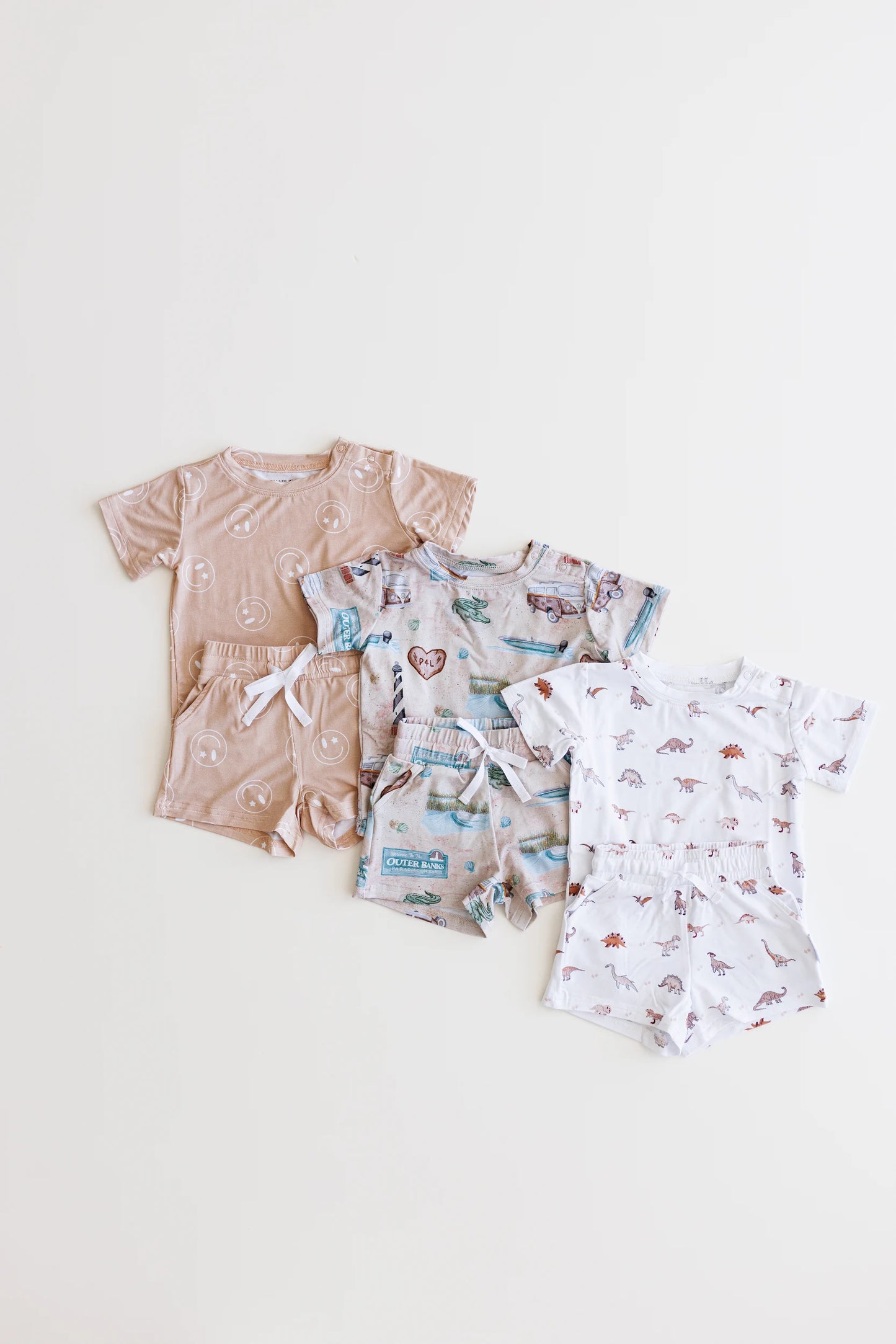 Bamboo shortie set with pockets, drawstring and shoulder snaps for boys and girls in Beige / Sand / Tan Smiley Face print.
