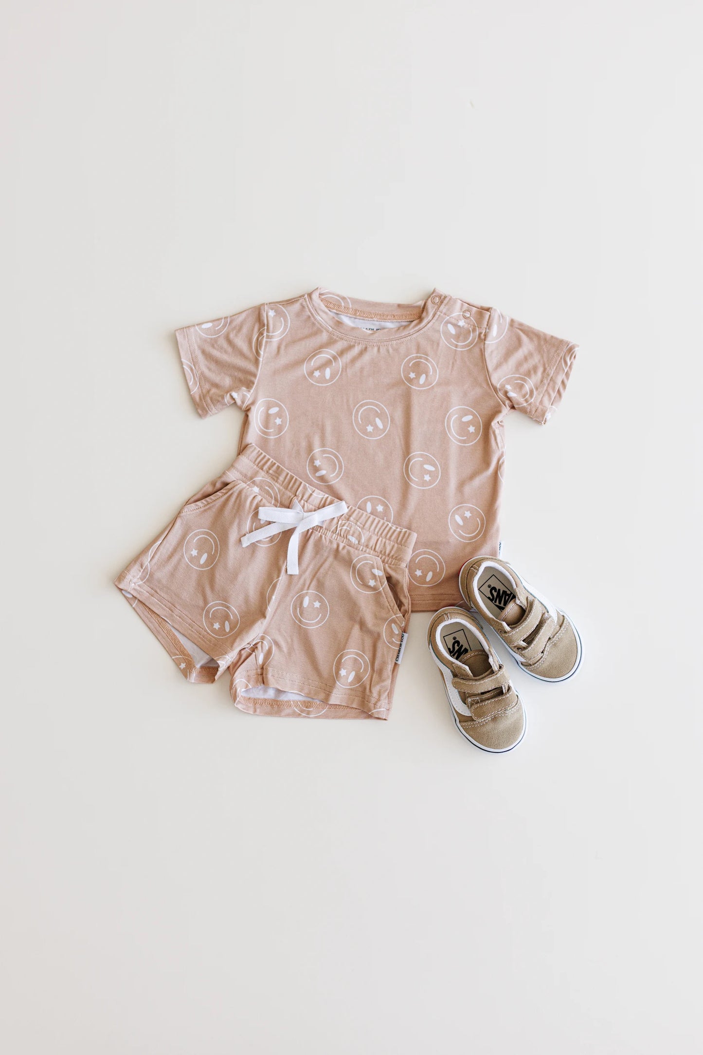 Bamboo shortie set with pockets, drawstring and shoulder snaps for boys and girls in Beige / Sand / Tan Smiley Face print.