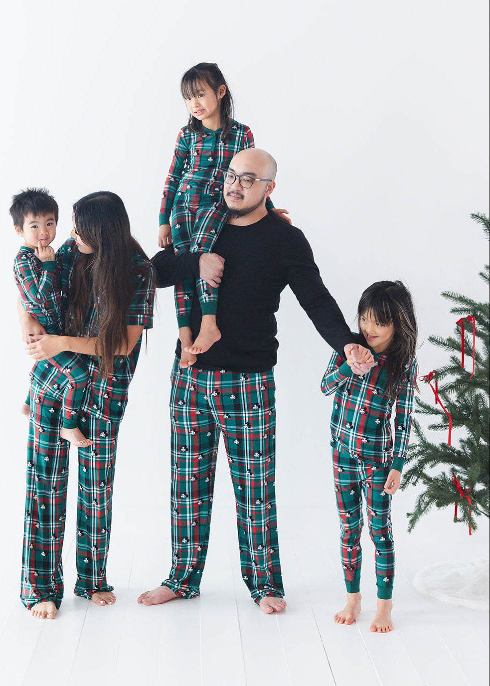 Men's bamboo Christmas Disney Mickey pajamas in green and red tartan print with family matching.