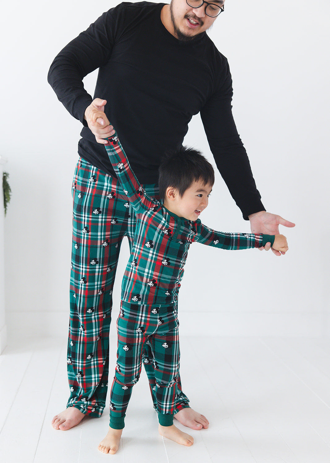Men's bamboo Christmas Disney Mickey pajamas in green and red tartan print with family matching.