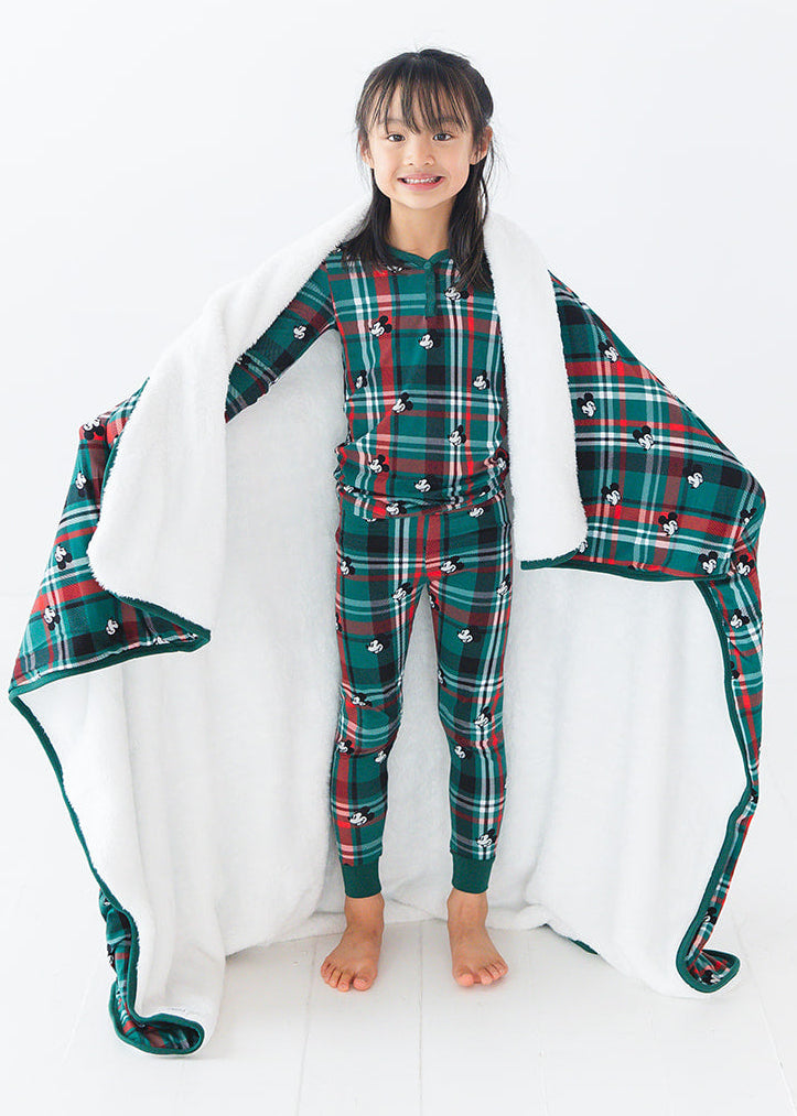 Green and red tartan bamboo plush blanket in Christmas Disney Mickey print.