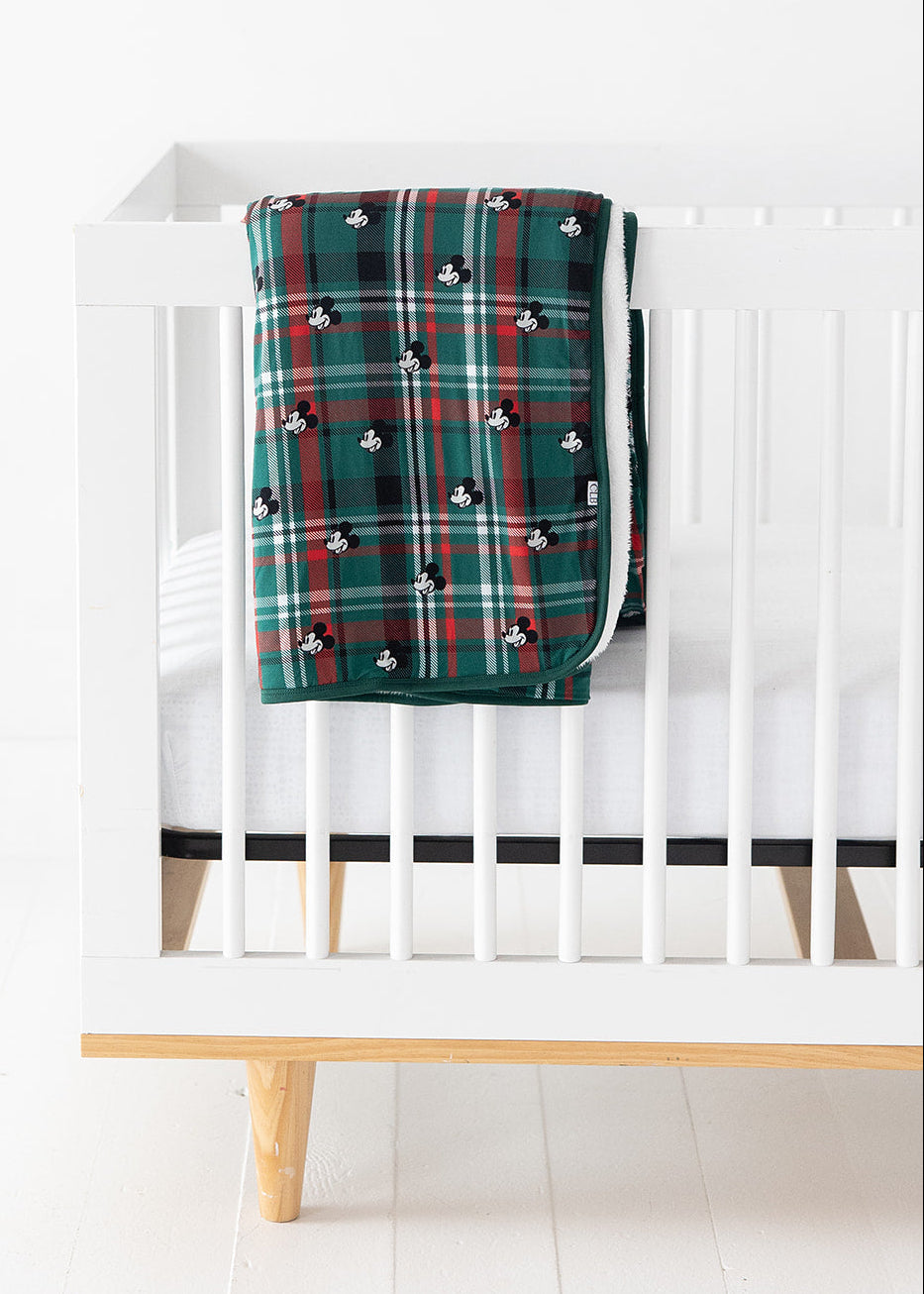 Green and red tartan bamboo plush blanket in Christmas Disney Mickey print.