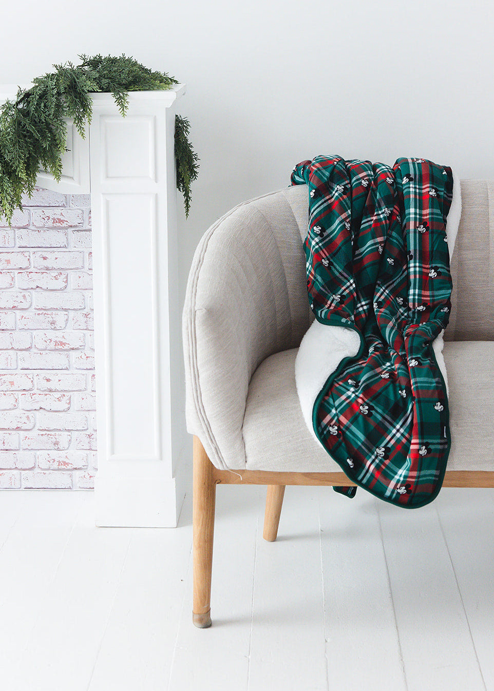 Green and red tartan bamboo plush blanket in Christmas Disney Mickey print.
