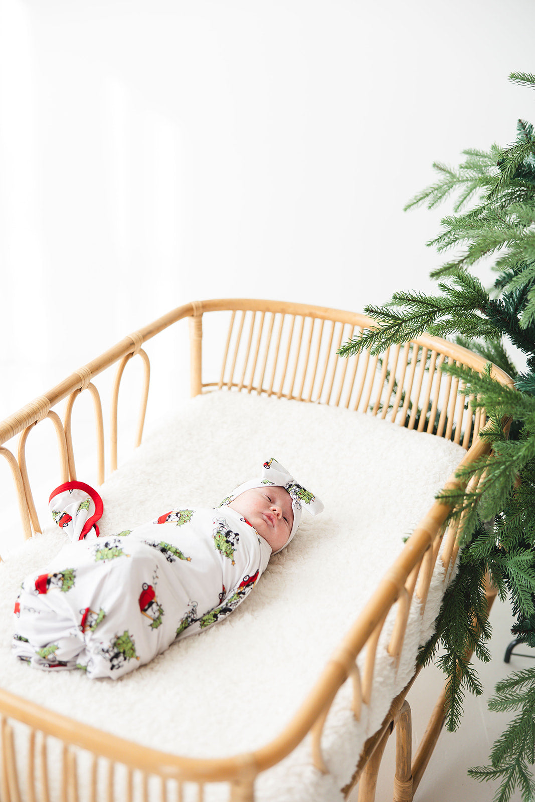 Gender-neutral bamboo swaddle featuring a festive Steamboat Willie Christmas design with Minnie and Mickey Mouse. Soft, breathable fabric perfect for babies, ideal for matching family Christmas pajamas. A cozy holiday essential for little ones.