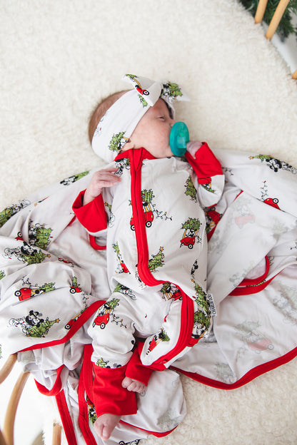 Gender-neutral bamboo swaddle featuring a festive Steamboat Willie Christmas design with Minnie and Mickey Mouse. Soft, breathable fabric perfect for babies, ideal for matching family Christmas pajamas. A cozy holiday essential for little ones.