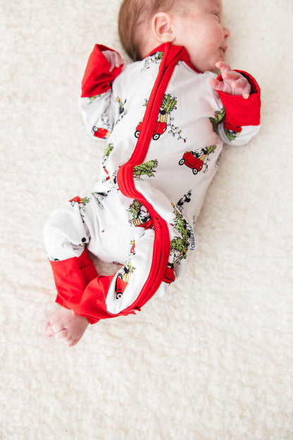 Gender-neutral convertible baby romper with hand and foot cuffs featuring a festive Steamboat Willie Christmas design with Minnie and Mickey Mouse. Includes a convenient double zipper for easy changes. Perfect for matching family Christmas pajamas.