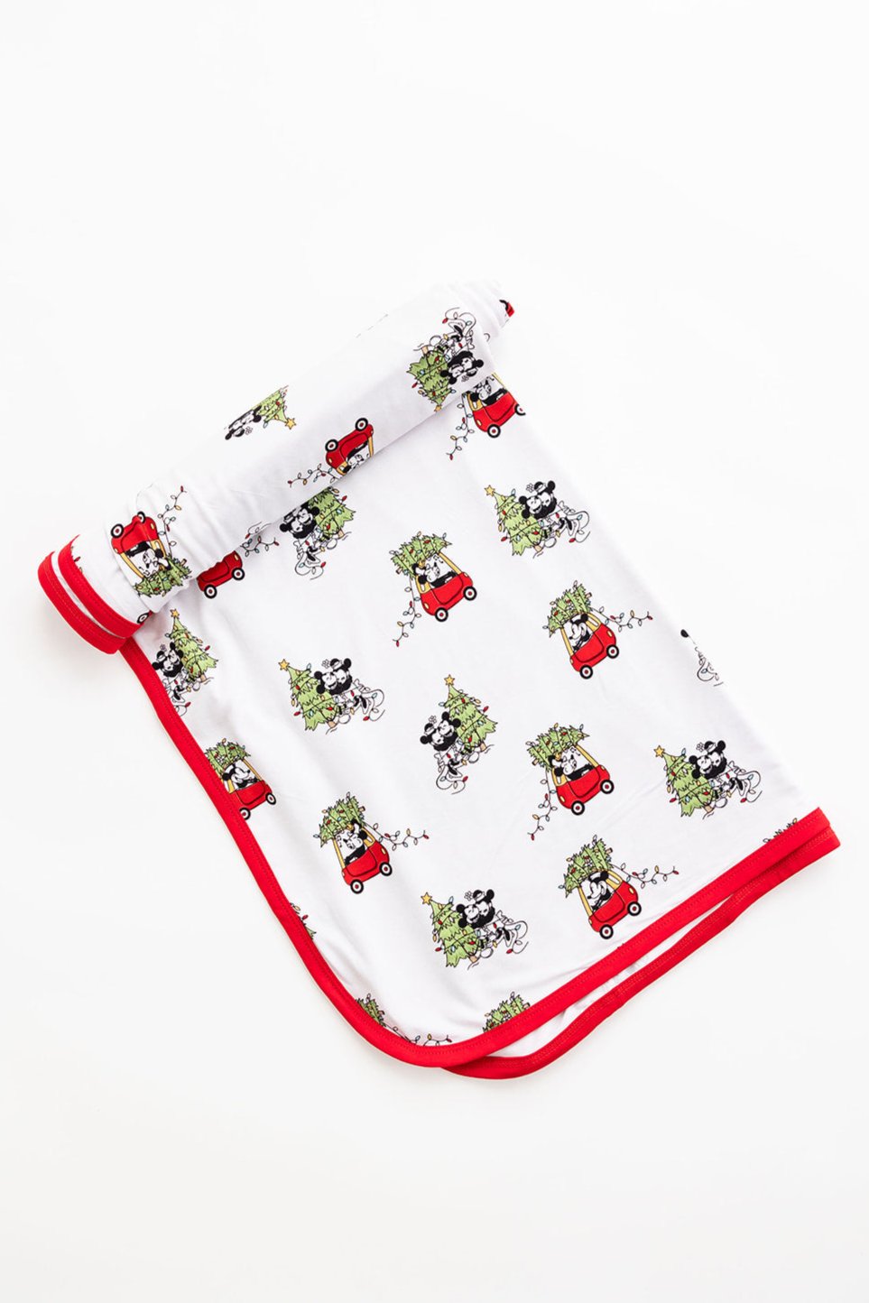 Gender-neutral bamboo swaddle featuring a festive Steamboat Willie Christmas design with Minnie and Mickey Mouse. Soft, breathable fabric perfect for babies, ideal for matching family Christmas pajamas. A cozy holiday essential for little ones.