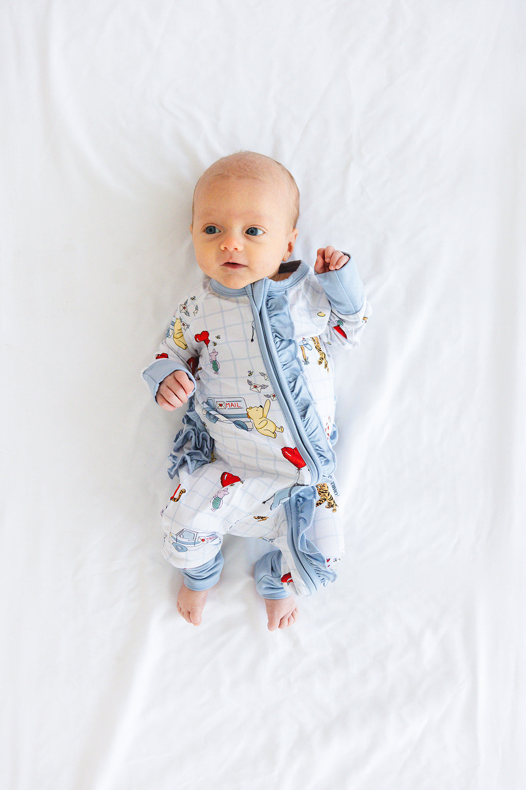 Vintage Winnie the Pooh bamboo pajama Ruffle Convertible Romper with Tigger, Eeyore and Piglet in a Valentine's Day print for baby and toddler boys and girls. Perfect for sibling matching and gender neutral.