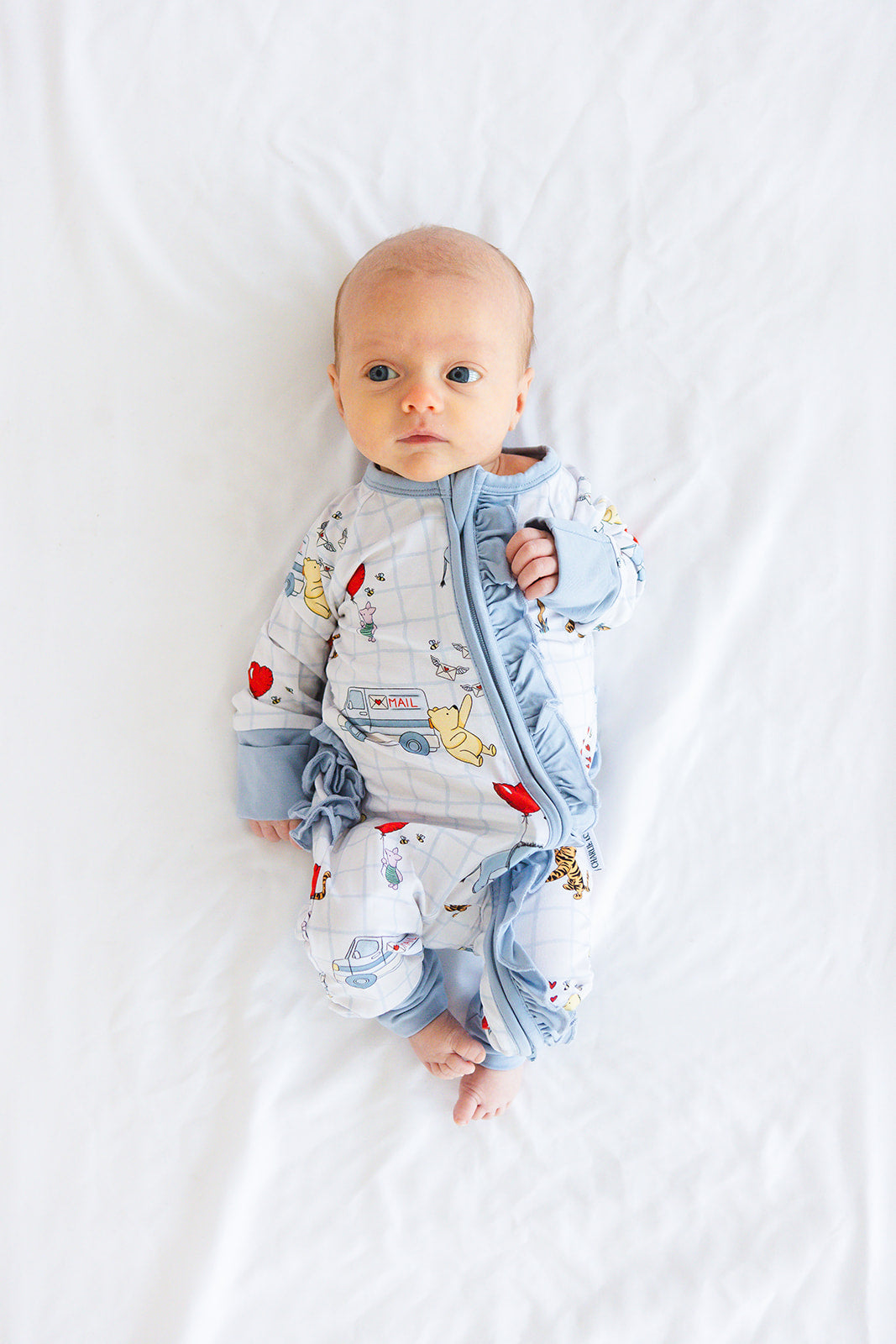 Vintage Winnie the Pooh bamboo pajama Ruffle Convertible Romper with Tigger, Eeyore and Piglet in a Valentine's Day print for baby and toddler boys and girls. Perfect for sibling matching and gender neutral.