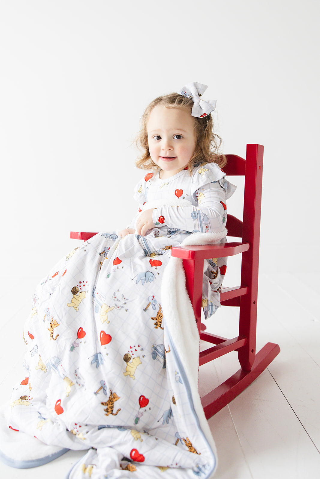 Vintage Winnie the Pooh bamboo alligator clip bow with Tigger, Eeyore and Piglet in a Valentine's Day print for baby and toddler boys and girls. Perfect for sibling matching and gender neutral.