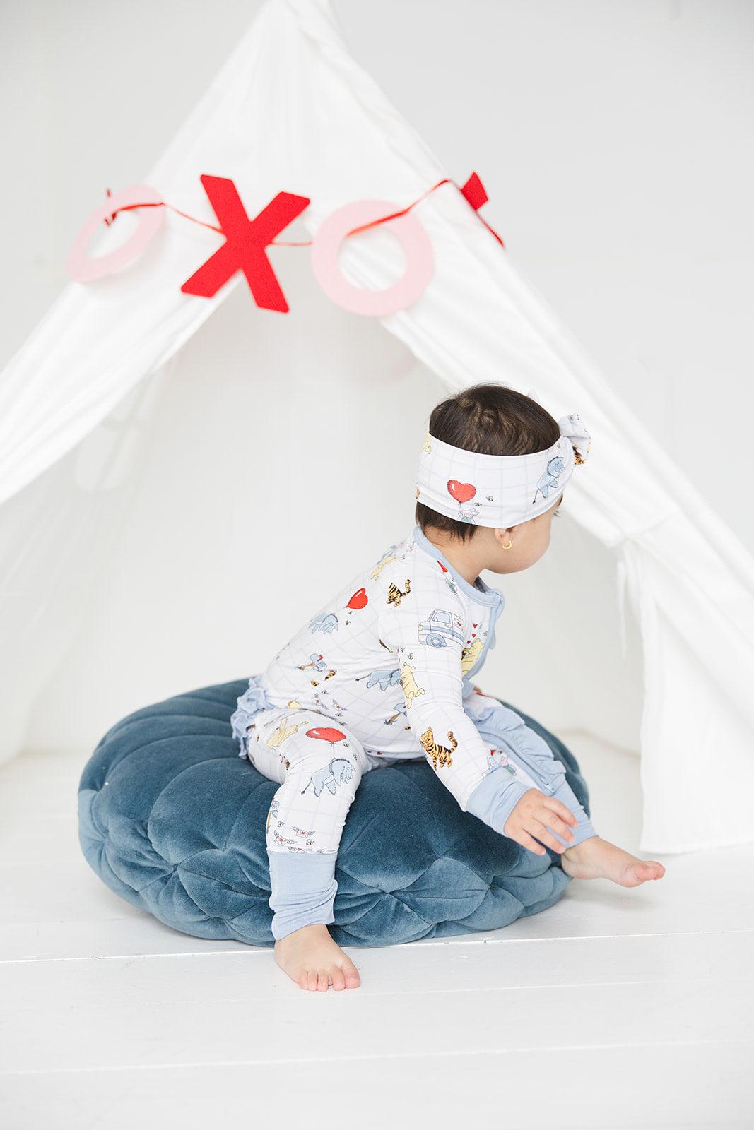 Vintage Winnie the Pooh bamboo pajama Ruffle Convertible Romper with Tigger, Eeyore and Piglet in a Valentine's Day print for baby and toddler boys and girls. Perfect for sibling matching and gender neutral.