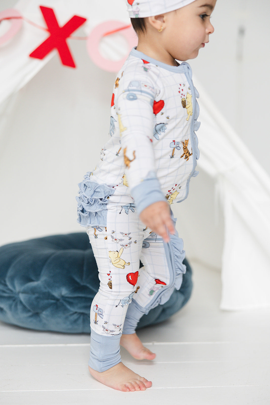 Vintage Winnie the Pooh bamboo pajama Ruffle Convertible Romper with Tigger, Eeyore and Piglet in a Valentine's Day print for baby and toddler boys and girls. Perfect for sibling matching and gender neutral.