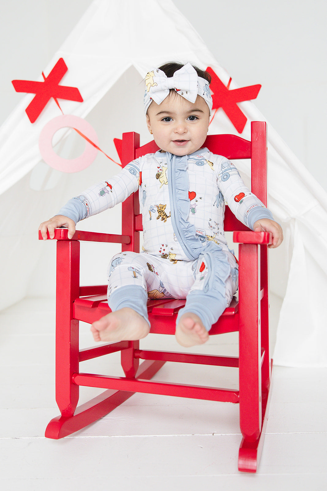 Vintage Winnie the Pooh bamboo pajama Ruffle Convertible Romper with Tigger, Eeyore and Piglet in a Valentine's Day print for baby and toddler boys and girls. Perfect for sibling matching and gender neutral.