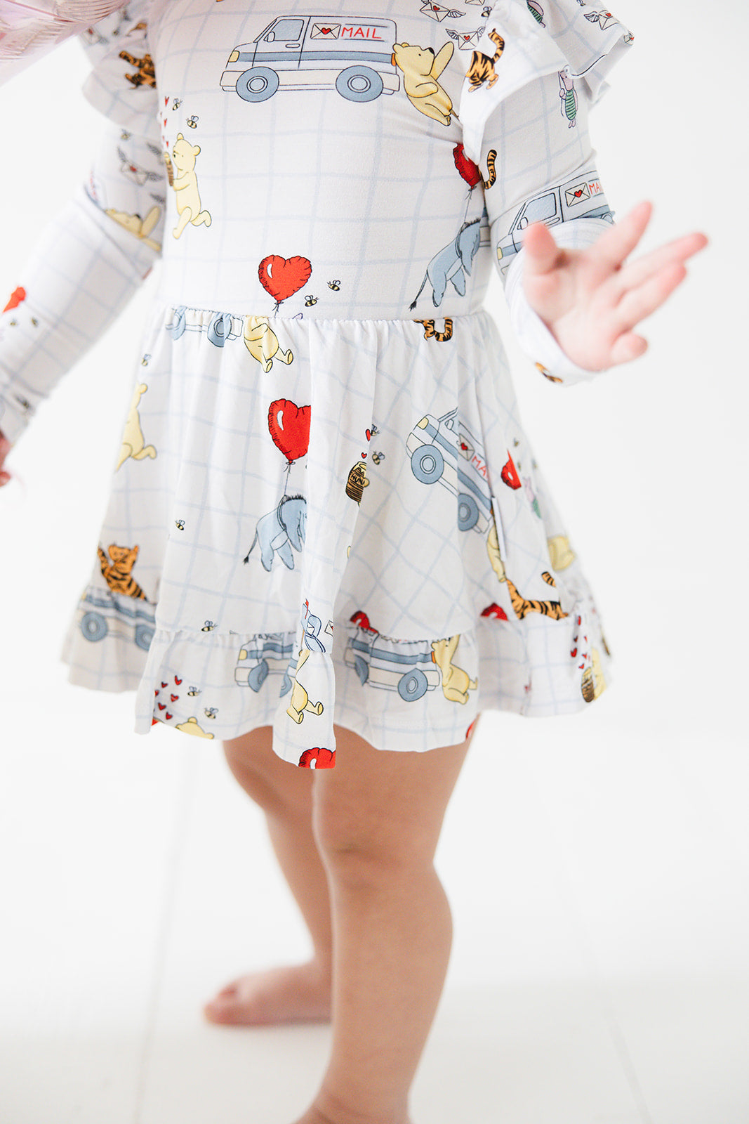 Vintage Winnie the Pooh bamboo twirl dress with Tigger, Eeyore and Piglet in a Valentine's Day print for baby and toddler boys and girls.