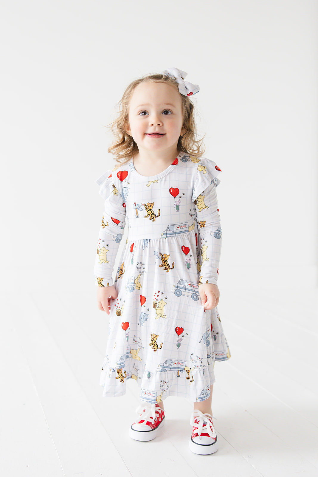 Vintage Winnie the Pooh bamboo twirl dress with Tigger, Eeyore and Piglet in a Valentine's Day print for baby and toddler boys and girls.