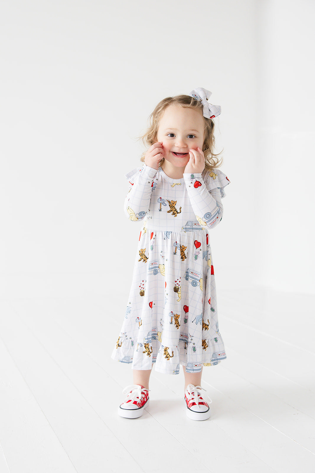 Vintage Winnie the Pooh bamboo twirl dress with Tigger, Eeyore and Piglet in a Valentine's Day print for baby and toddler boys and girls.