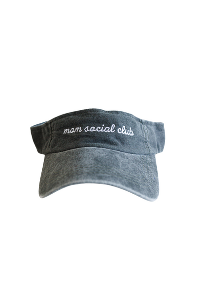 Washed and vintage style visor which is green with words mom social club on it.