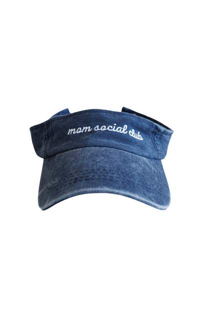 Washed and vintage style visor which is blue with words mom social club on it.