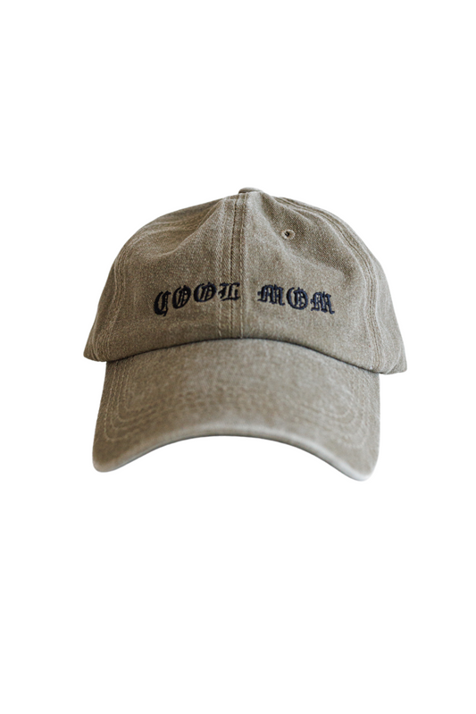 Women's hat in green and beige that says Cool Mom in washed vintage style.