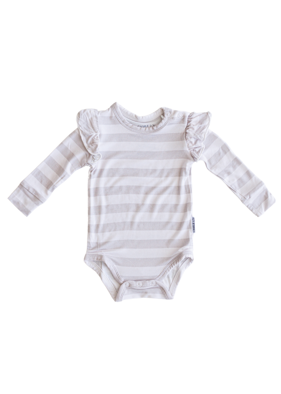 Ruffle bamboo bodysuit with crotch snaps and hand cuffs in neutral striped print.