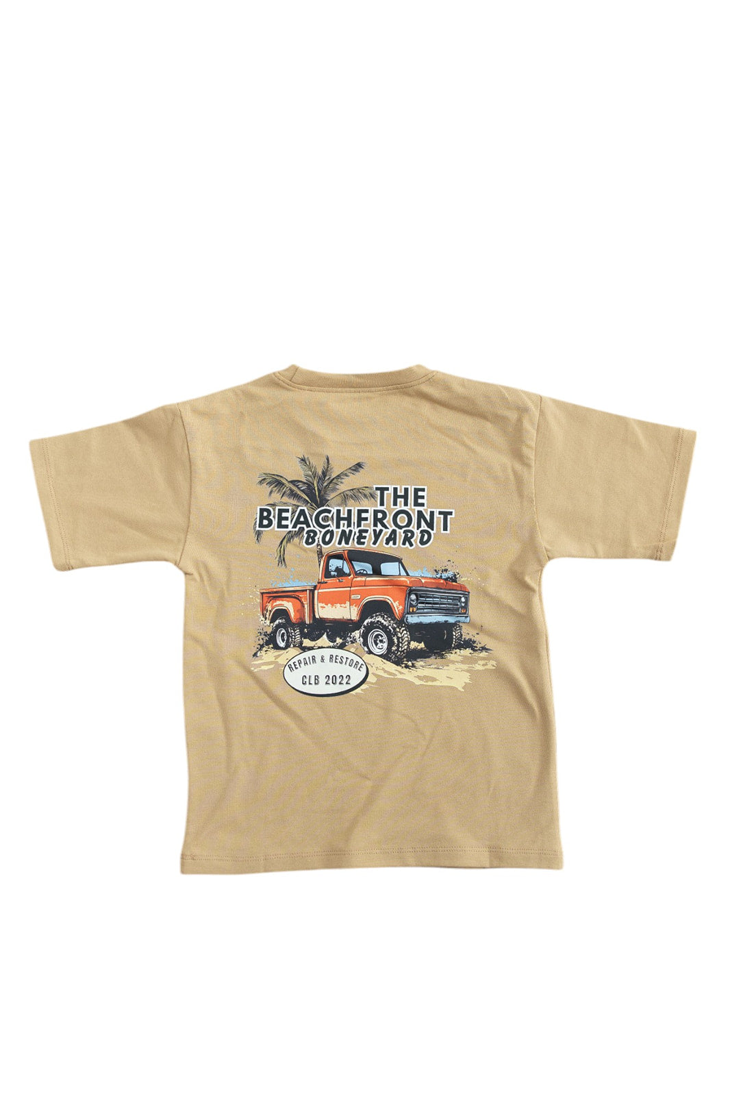 Skater style t-shirt for baby, toddler and little boys. Beige cotton shirt with a truck and palm tree graphic on the back. Soft, stretchy and thick fabric that is perfect for play with Charlie Lou Baby word logo on front.