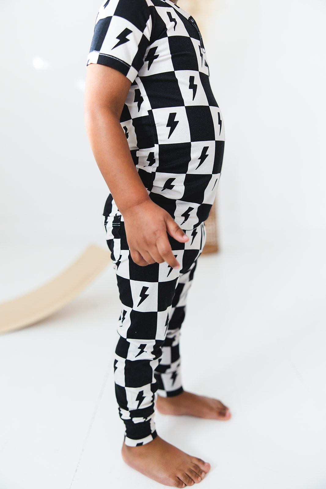 Checkered lightning bamboo two piece pajama set for babies and toddlers, both boys and girls.