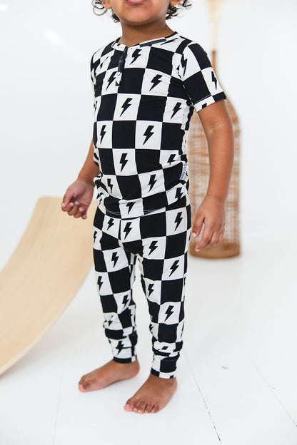 Checkered lightning bamboo two piece pajama set for babies and toddlers, both boys and girls.