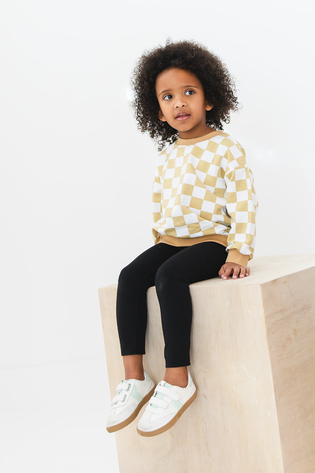 Yellow checkered organic cotton sweater for baby and toddler boys and girls.